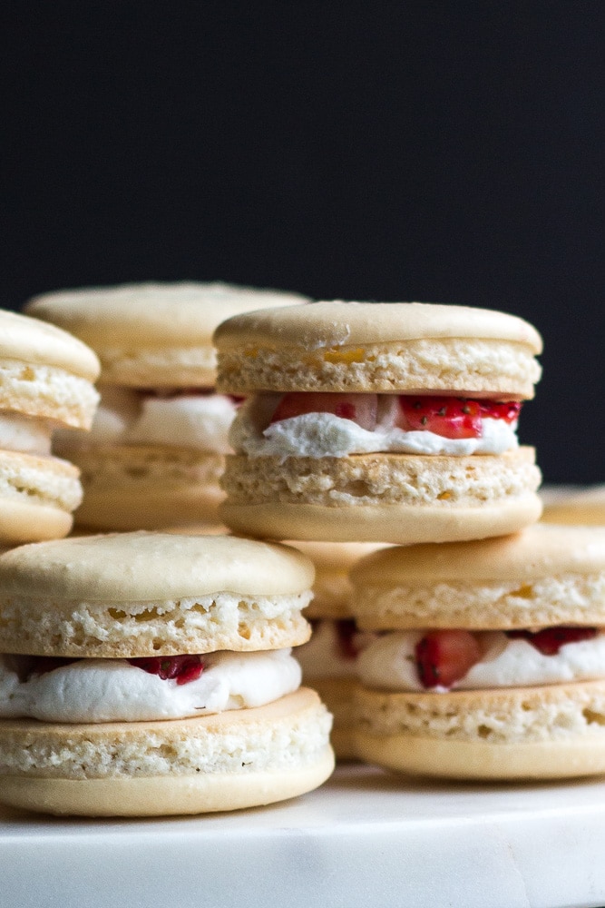 Side view of the Strawberry Shortcake Macarons stacked on top of each other