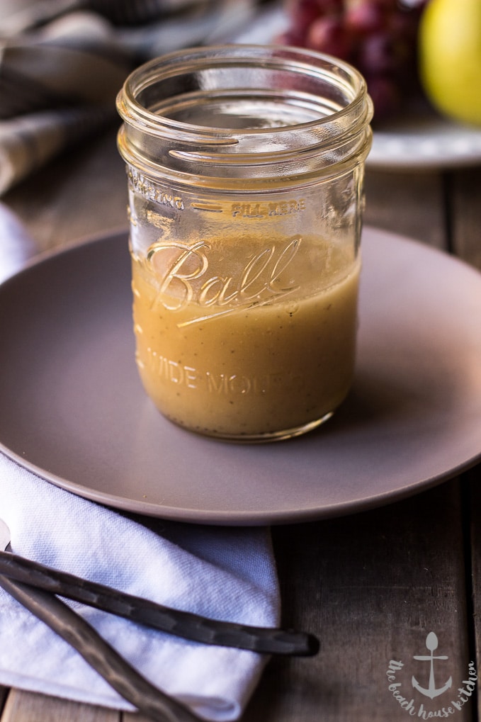 A jar of salad dressing on a gray plate