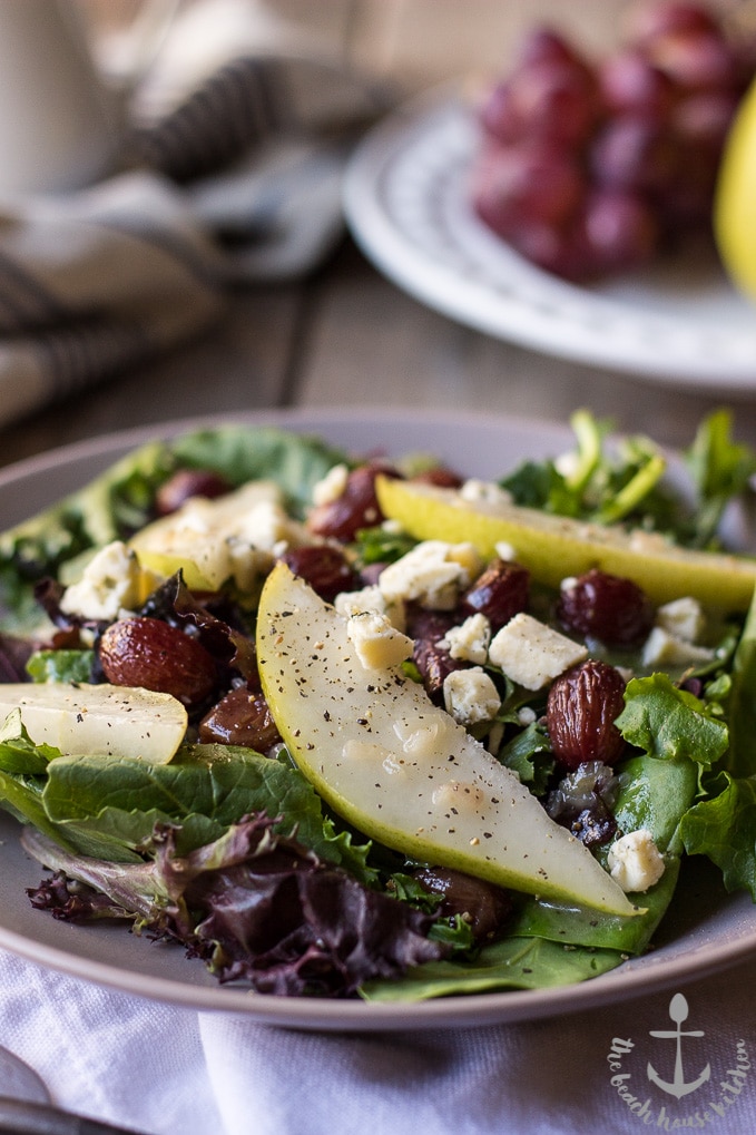 Up close photo of a Roasted Grape Salad with Pears, Blue Cheese and Maple Dressing