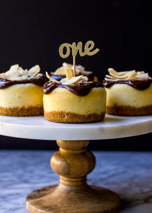 Vanilla Bean Cheesecakes with Toasted Coconut Crust Topped with Chocolate Ganache