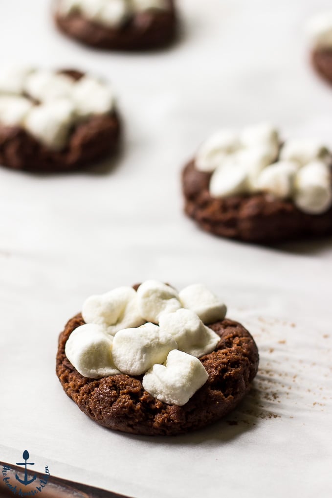 Prebaked Hot Chocolate Marshmallow Cookies on baking sheet lined with parchment paper.