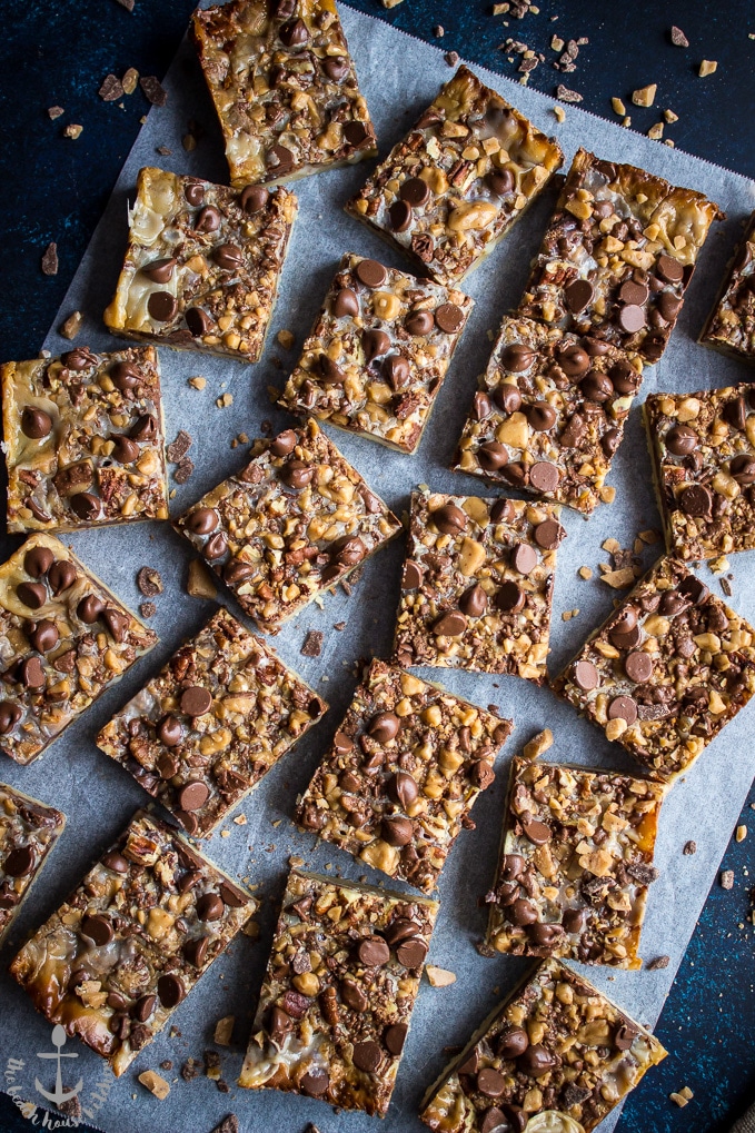 Overhead photo of Easy Toffee Chocolate Chip Bars on a sheet on white parchment paper.