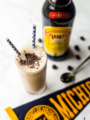 Boozy Coffee Milkshake with bottle of Kahlua and Michigan pennant in background