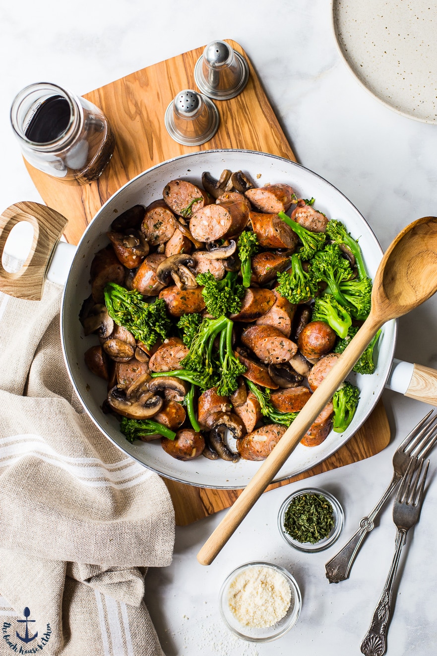 Overhead photo of a skillet of sausage and broccoli