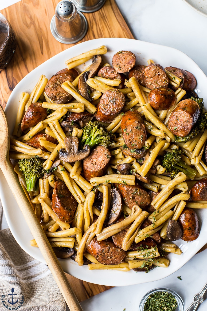 Up close overhead photo of a platter of Balsamic Pasta with Chicken Sausage, Broccoli and Mushrooms