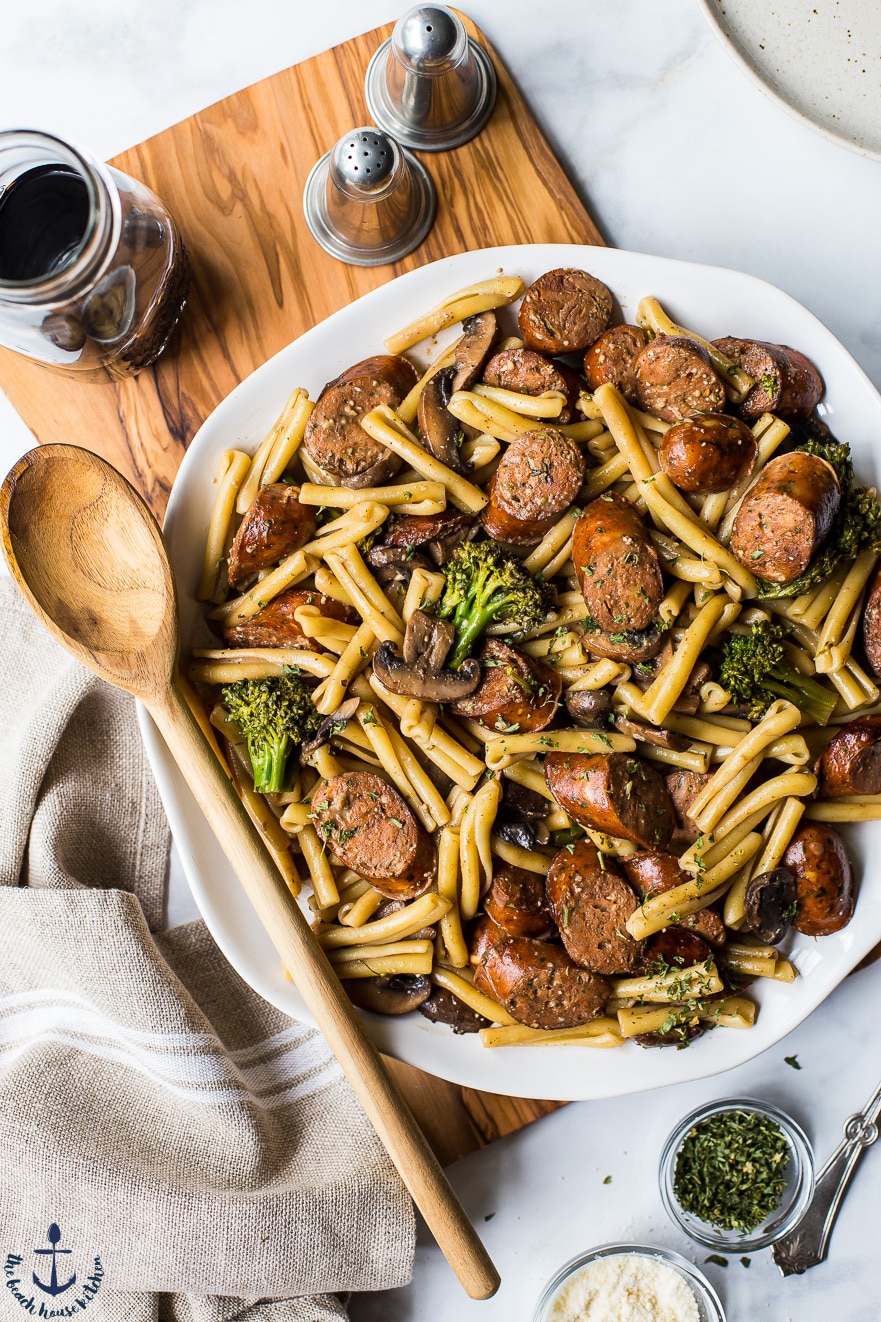 Overhead photo of a platter of Balsamic Pasta with Chicken Sausage, Broccoli and Mushrooms