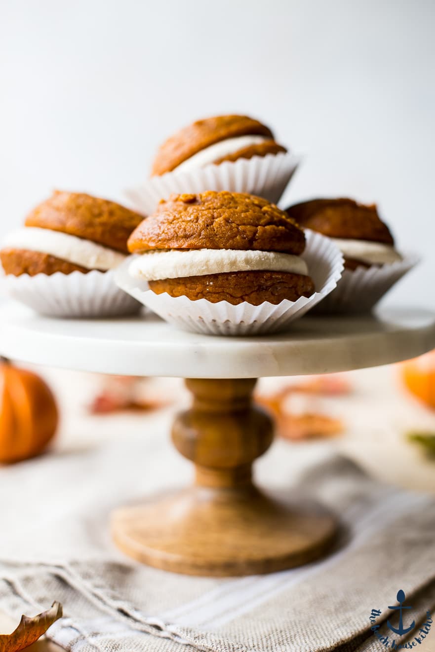 Up close photo of a marble cake stand topped with whoopie pies