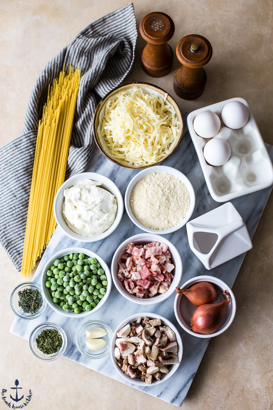 Ingredients for a spaghetti pie on a marble board