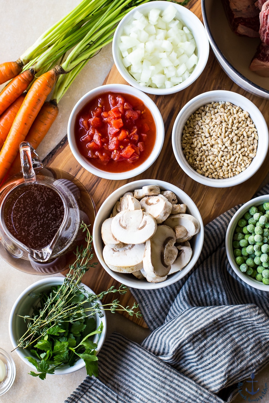Overhead photo of ingredients for Beef Barley Soup in individual bowls