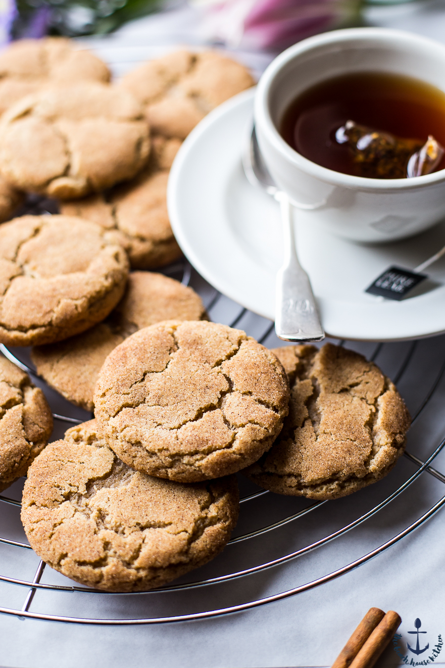 Chai Snickerdoodle Cookies on a wire rack with a cup of tea