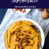 Overhead photo of mashed sweet potatoes topped with crispy prosciutto