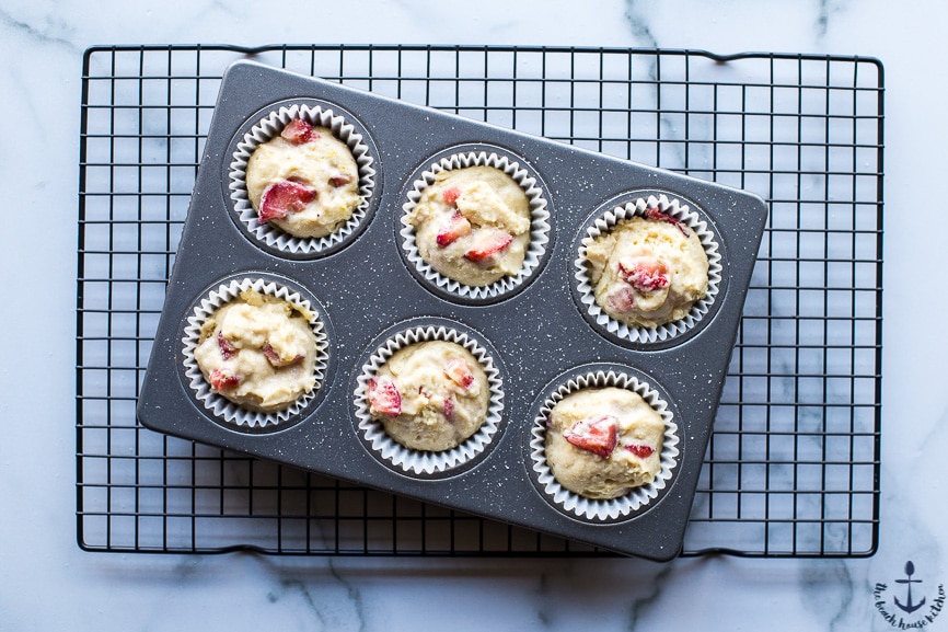 Overhead photo of pre-baked strawberry lemon muffins in muffin pan
