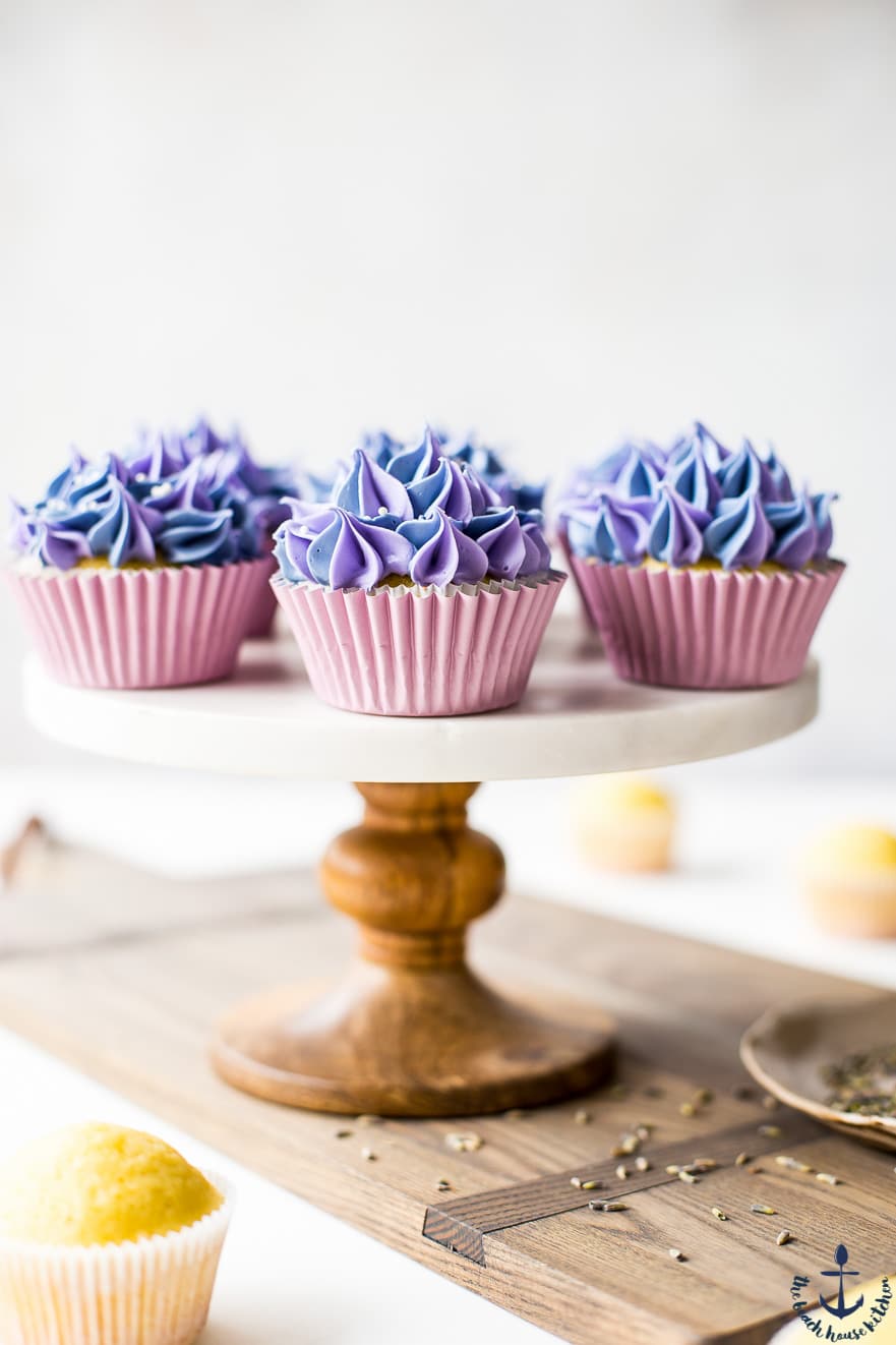 Photo of Lemon Olive Oil Cupcakes with Lavender buttercream on cakestand