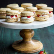 Cake stand topped with Strawberry shortcake macarons