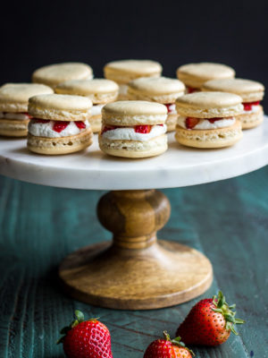 Cake stand topped with Strawberry shortcake macarons