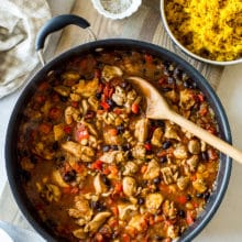 Overhead photo of Cuban spiced chicken and rice in a skillet