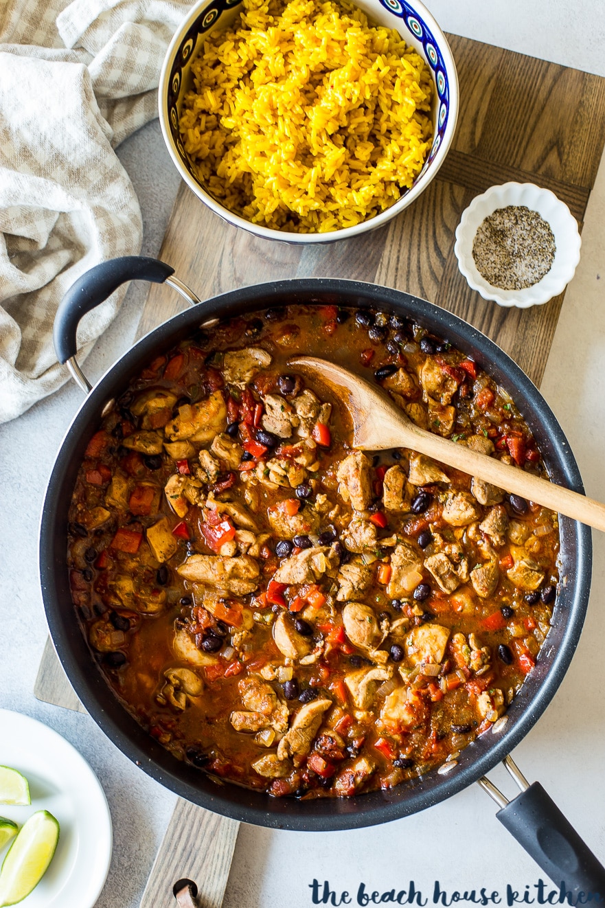 Overhead photo of Cuban spiced chicken and rice in skillet