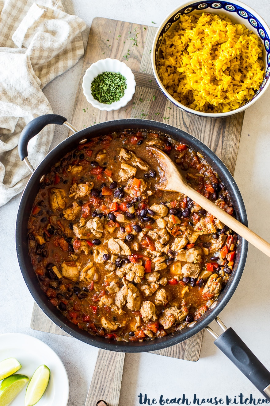 Overhead photo of Cuban spiced chicken and rice in skillet