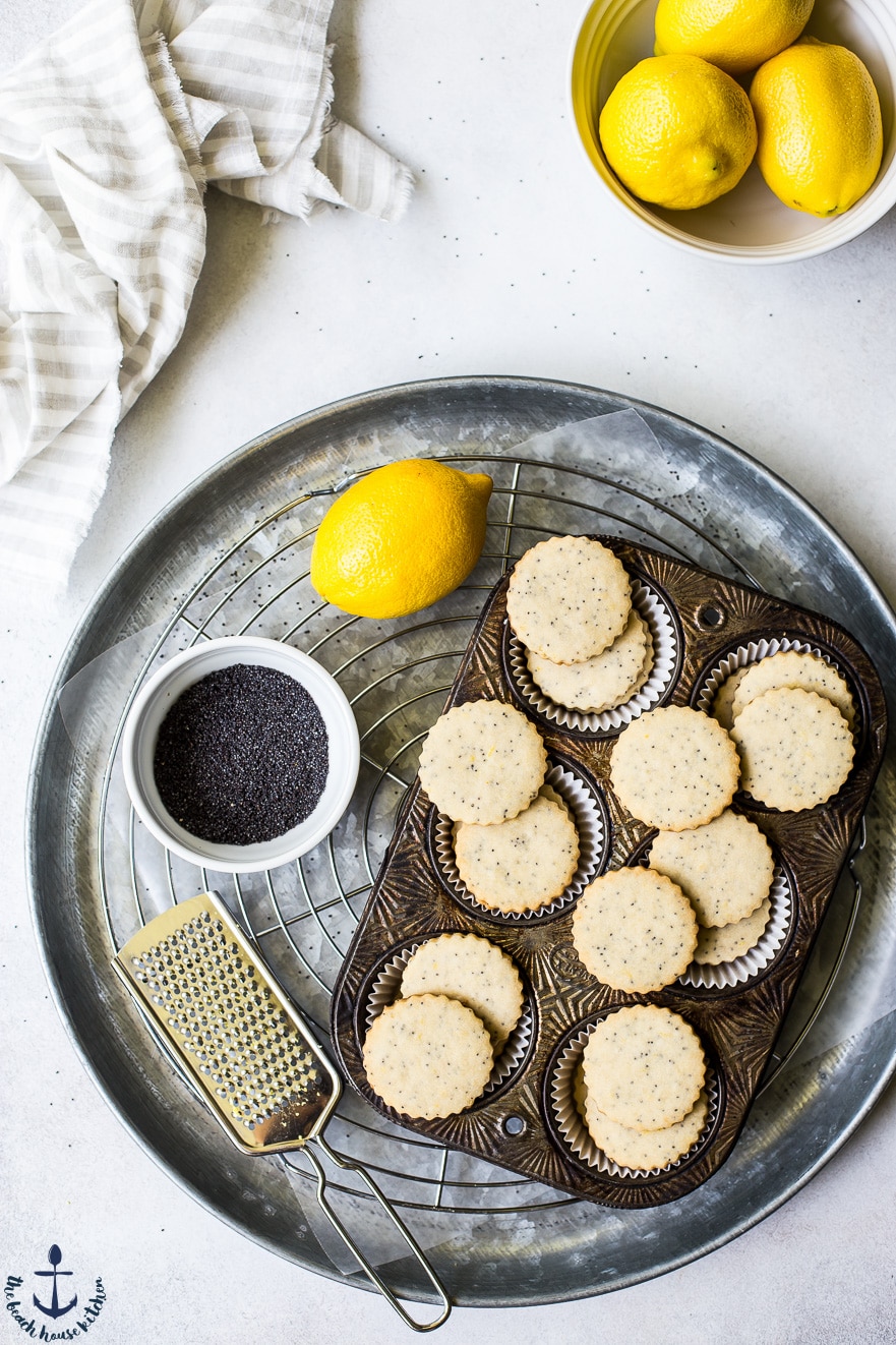 Overhead photo of lemon poppyseed cookies in a muffin tin