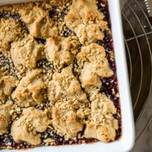 Overhead photo of peanut butter and jelly bars in white square pan