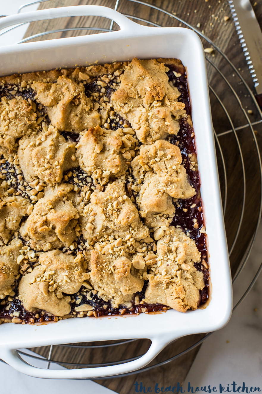 Overhead photo of peanut butter and jelly bars in white square pan