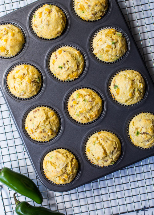 Overhead photo of cheddar bacon jalapeno muffins in muffin pan