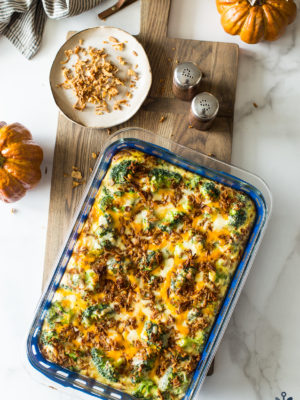 Overhead photo of easy holiday broccoli casserole on a wooden board