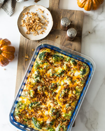 Overhead photo of easy holiday broccoli casserole on a wooden board