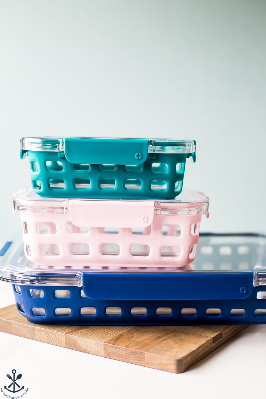 Photo of stack of three Ello baking dishes with silicone sleeves.