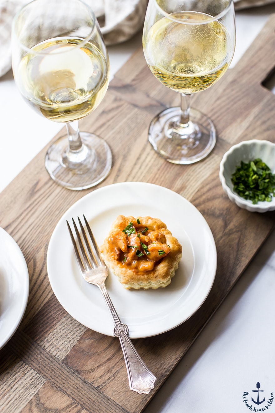 Overhead photo of a shrimp etouffee vol au vent on a white plate with a fork
