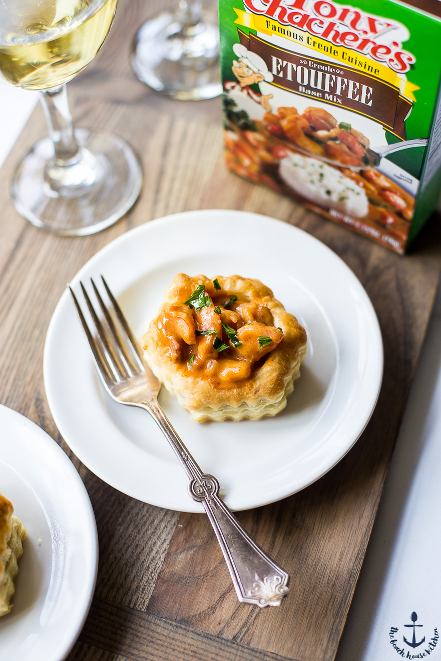 Overhead photo of a shrimp etouffee vol au vent on a white plate with a fork