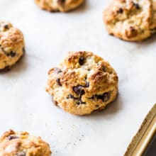 Overhead photo of chocolate chip toasted coconut scones on a baking sheet