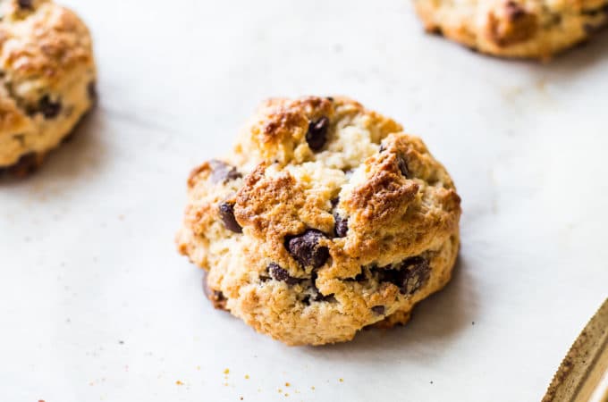 Overhead photo of chocolate chip toasted coconut scones on a baking sheet