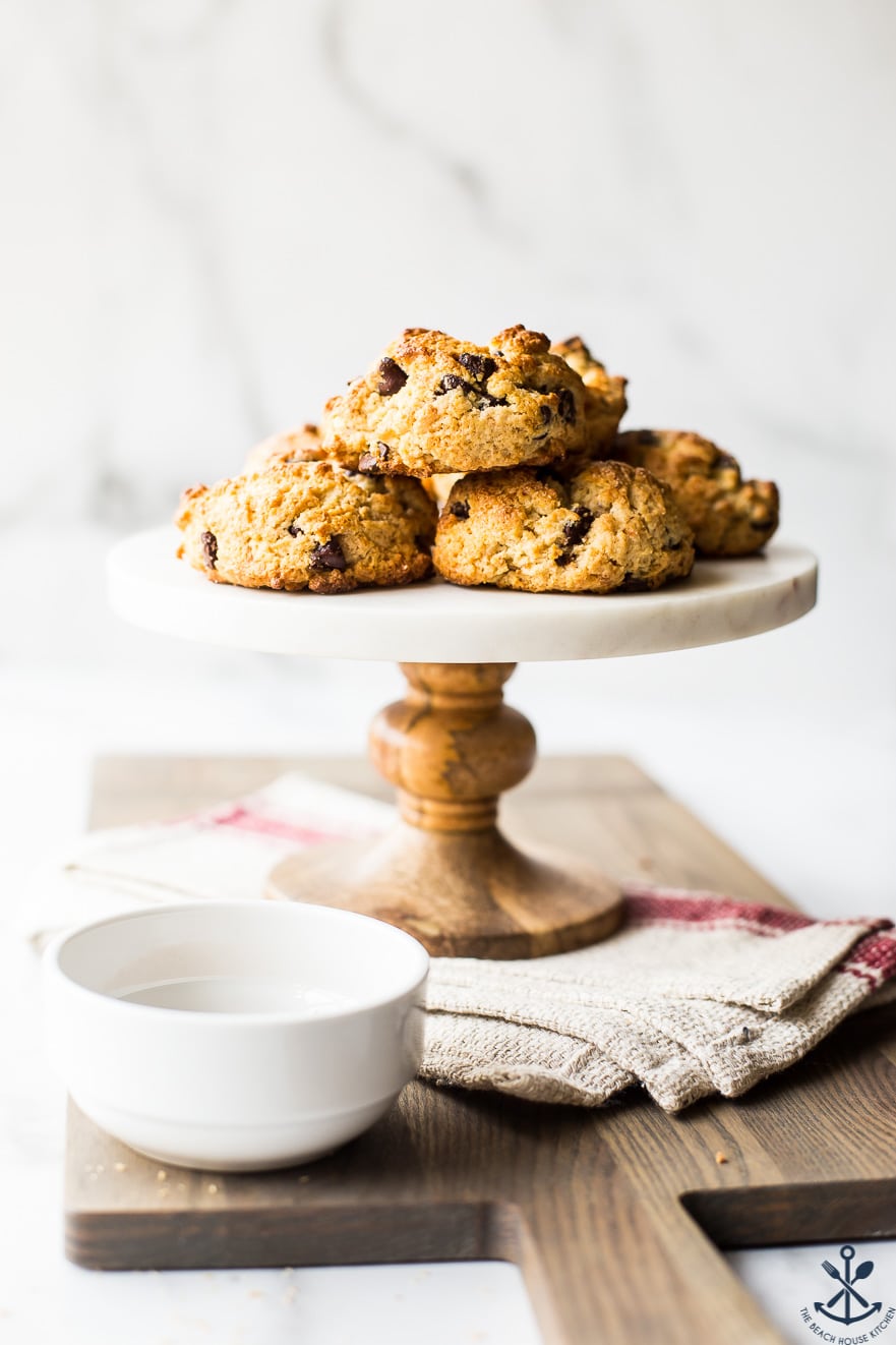 Chocolate chip toasted coconut scones on a cake stand