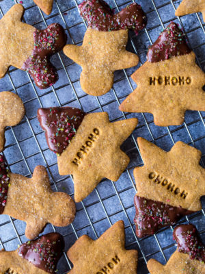 Overhead photo of chocolate dipped gingerbread shortbread cut out cookies