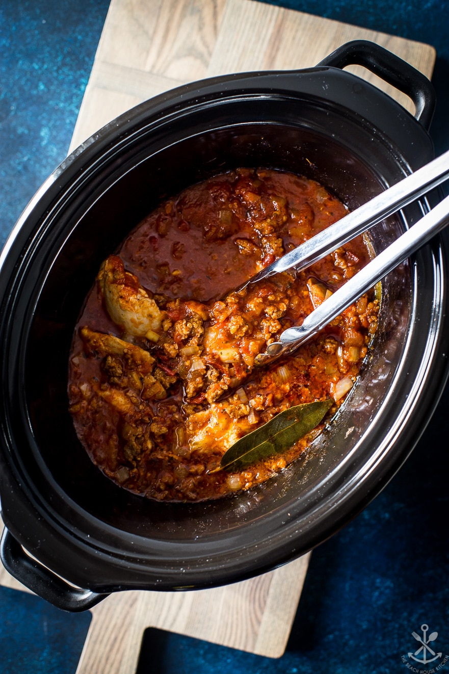 Overhead photo of chicken tinga in a slow cooker