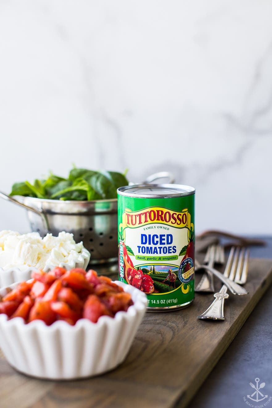 Photo of a can of diced tomatoes with a white bowl full of diced tomatoes