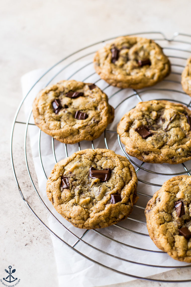 Six Almond Joy Chocolate Chip Cookies on a round wire cooling rack