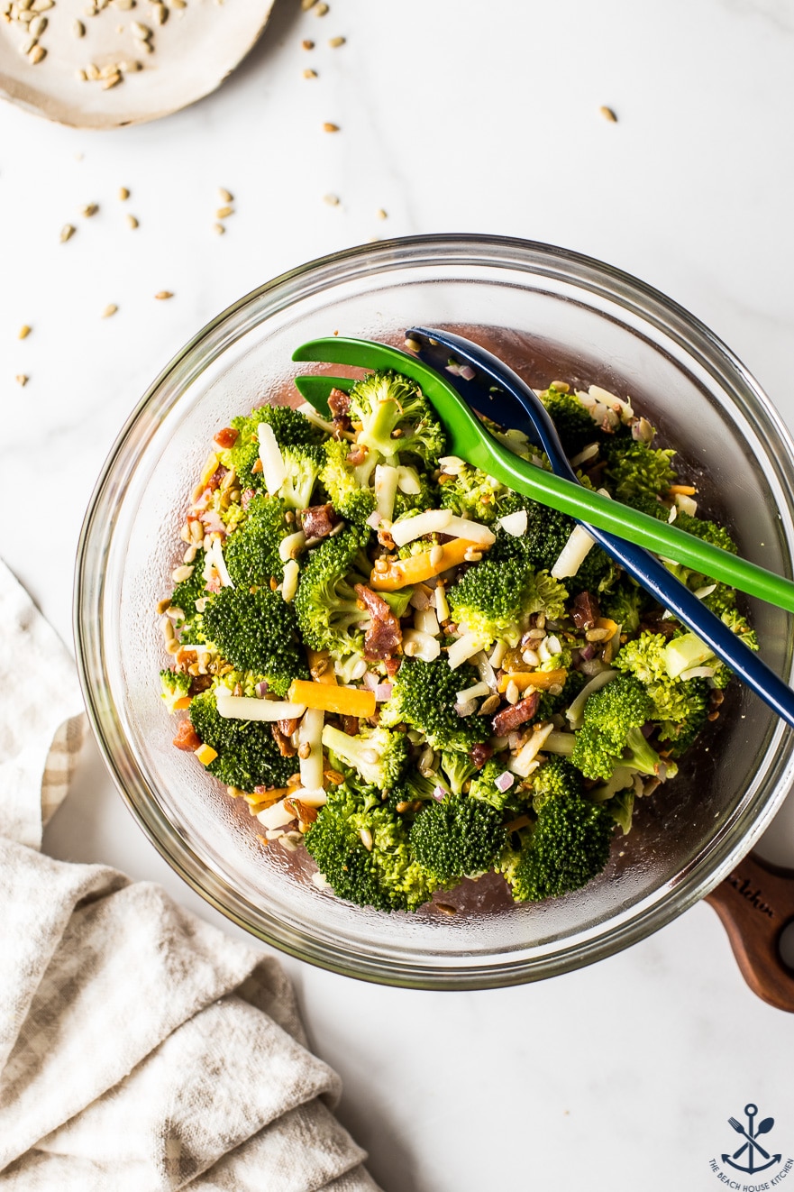 Overhead photo of classic broccoli salad with bacon in a glass bowl