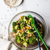 Overhead photo of classic broccoli salad with bacon in a glass bowl