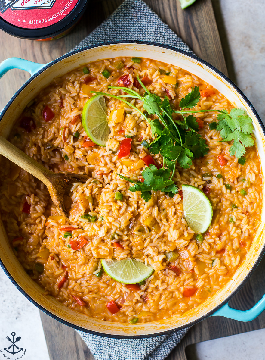 Overhead photo of skillet filled with cheesy queso fiesta rice