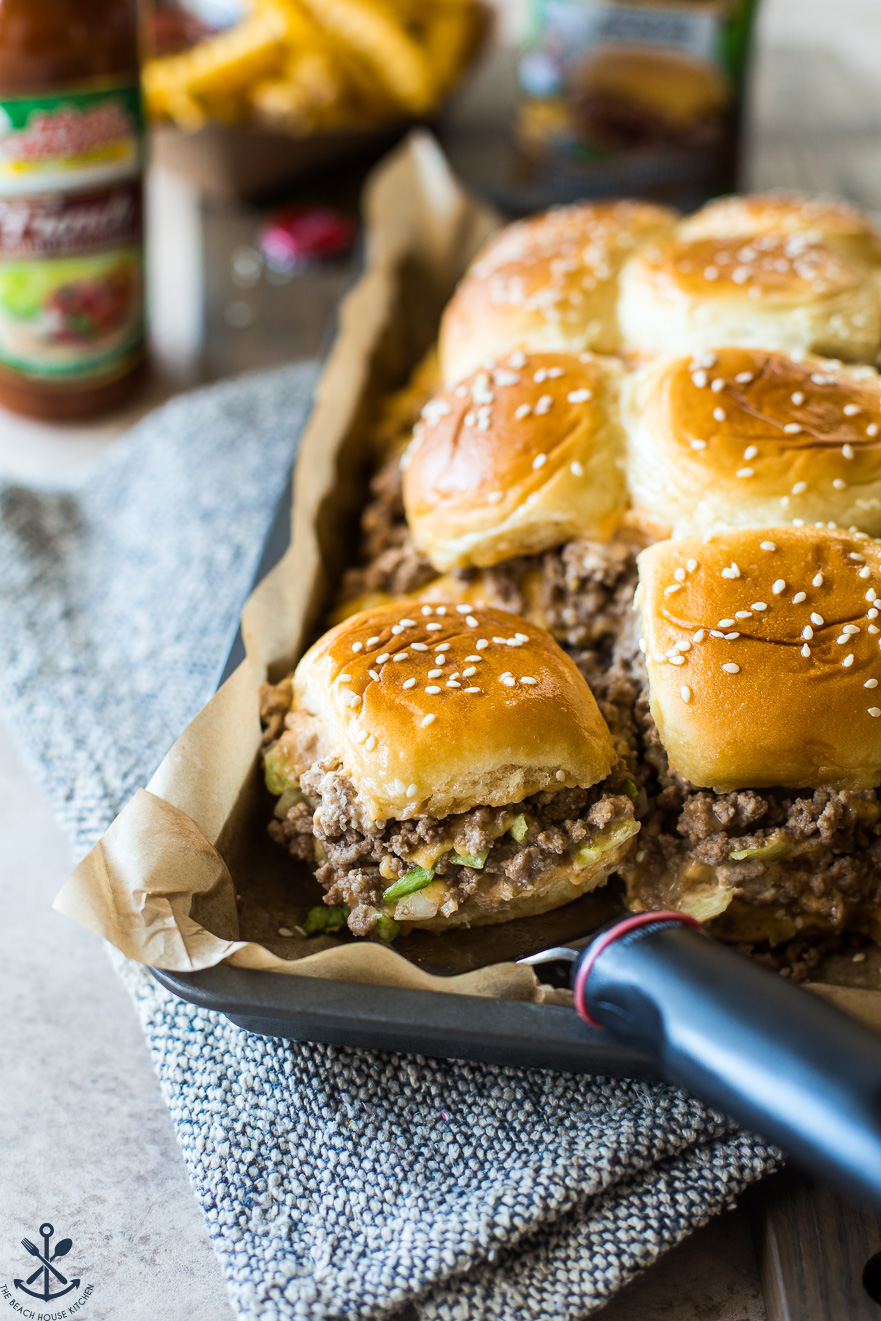 Tony's Baked Cheeseburger Sliders on a tray lined with parchment paper