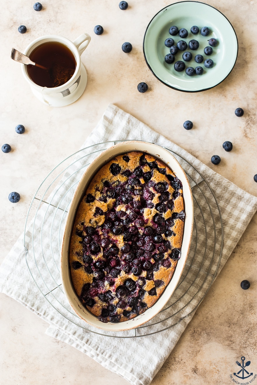Overhead photo of Earl Grey Blueberry Cobbler in an oval baking dish