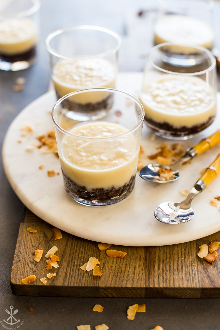 Coconut cream pie parfaits on a round marble board