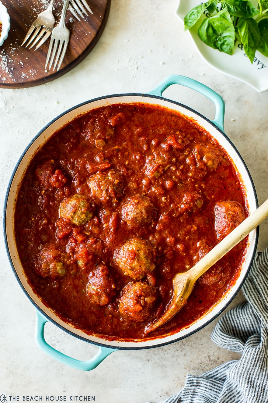 Overhead photo of skillet filled with Mom's meatballs and marinara sauce