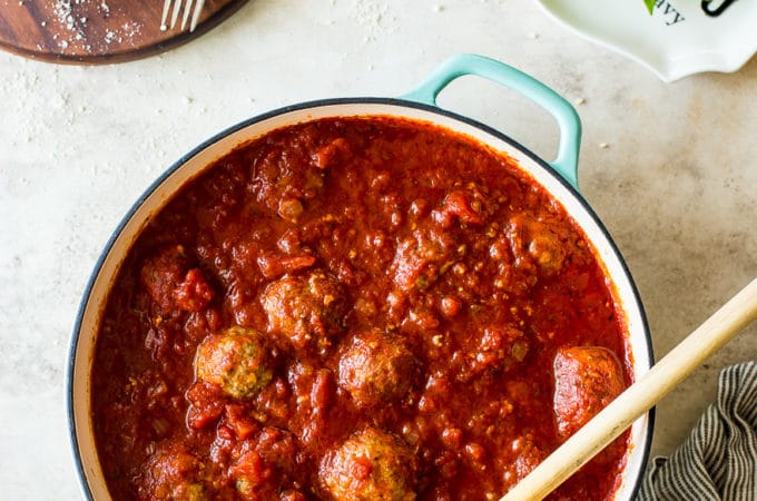 Overhead photo of a skillet filled with Mom's meatballs and marinara sauce