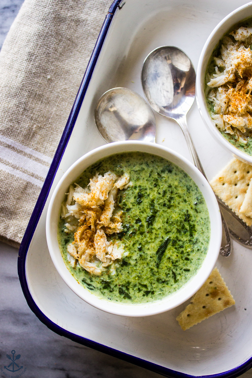 Overhead photo of Creamy Spinach Soup with Crabmeat with two spoons and crackers