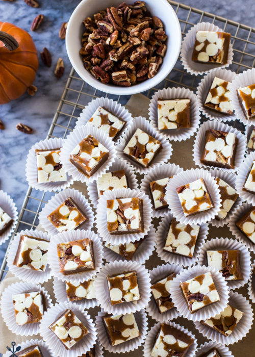 Overhead photo of Pumpkin Spice White Chocolate Pecan Caramels in white paper cups