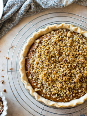 Overhead photo of Sweet Potato Pie with Pecan Topping on a round wire rack