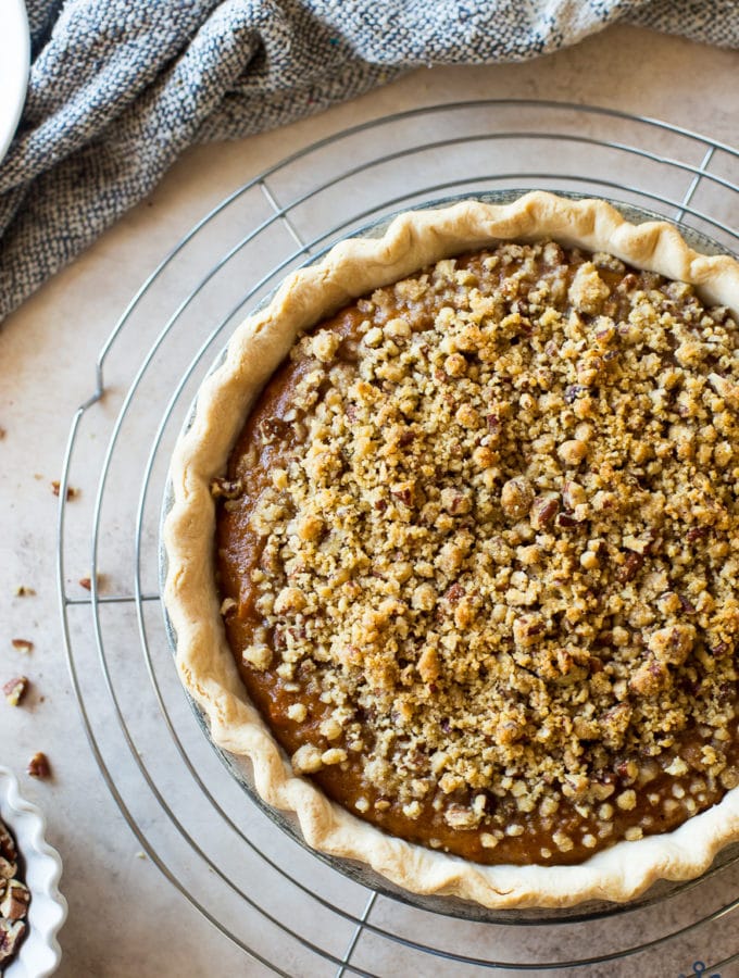 Overhead photo of Sweet Potato Pie with Pecan Topping on a round wire rack